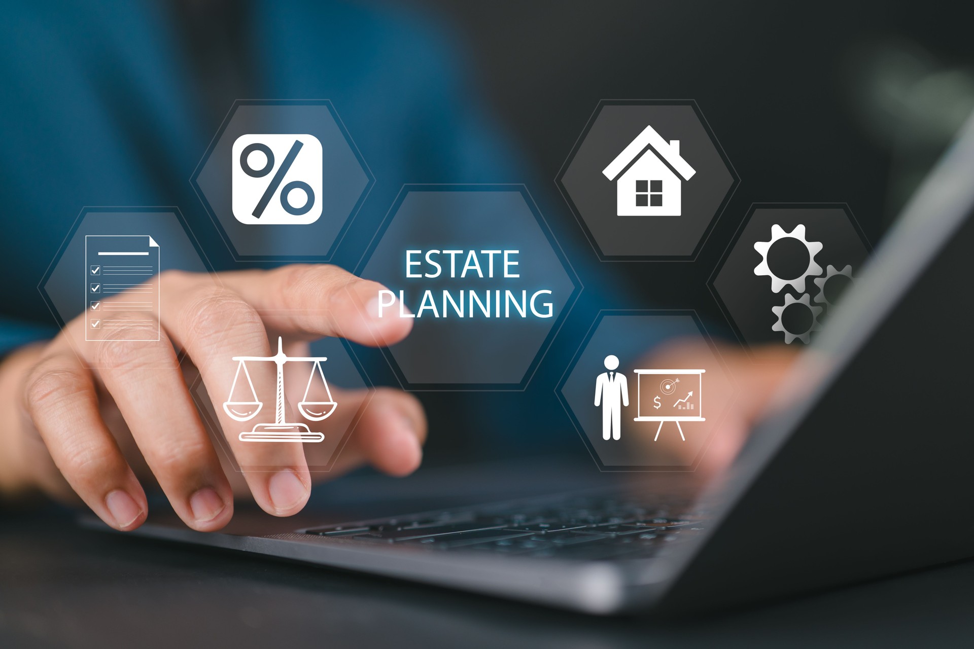 Estate Planning concept. Planning for transfer of assets and Inheritance tax. Businessman using laptop with estate planning icons on virtual screen.